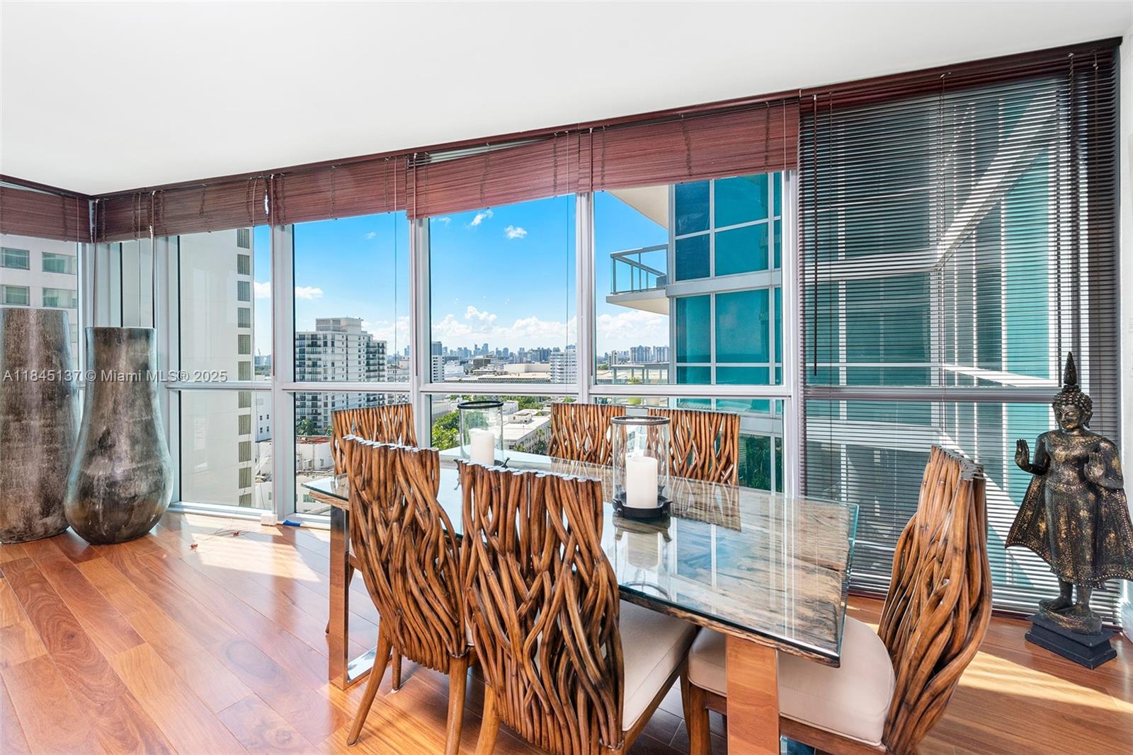 101 20th Street, Unit 1706 Miami Beach, FL 33139 - Photo 2 of 9 a view of a living room and dining room with wooden floor