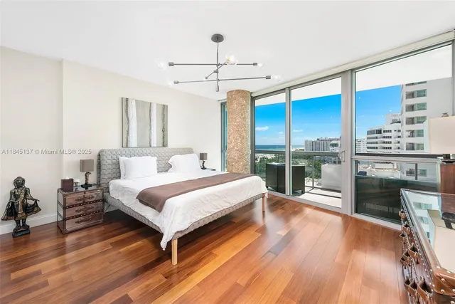 a bedroom with a bed lamps and fireplace