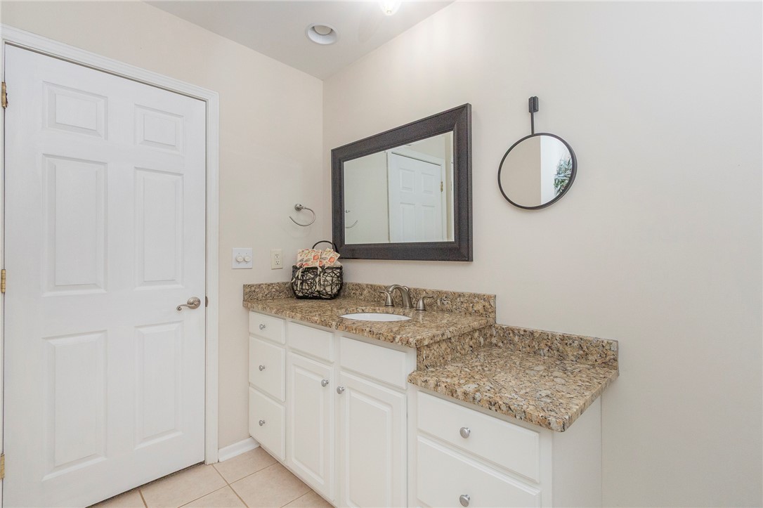 125 Inlet Pointe Drive Anderson, SC 29625 - Photo 24 of 39 Elegant granite countertops adorn this well-appointed bathroom vanity, offering both style and utility.