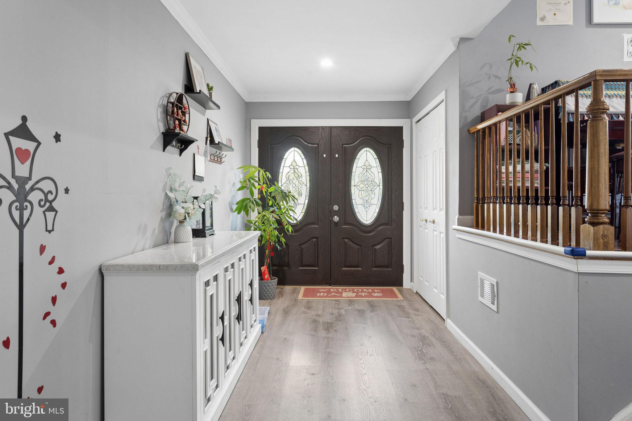 252 Sandringham Road Cherry Hill, NJ 08003 - Photo 5 of 31 a view of entryway with wooden floor