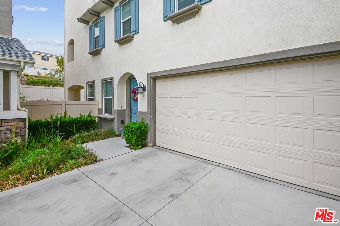 7329 Garnet Ridge Road Jurupa Valley, CA 92509 - Photo 4 of 35 a front view of a house with garden