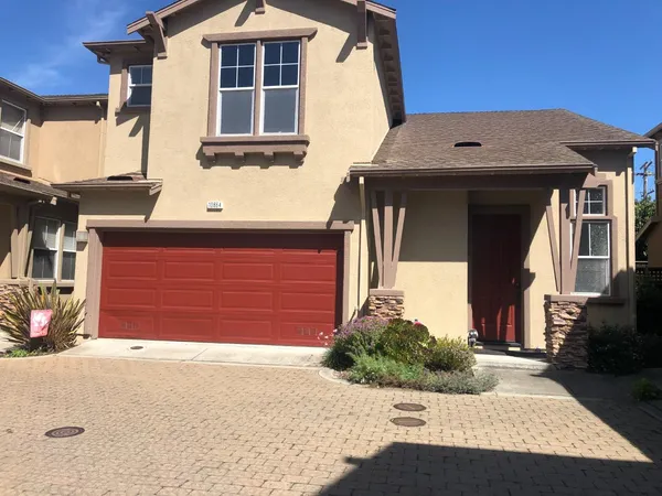 a front view of a house with a garage