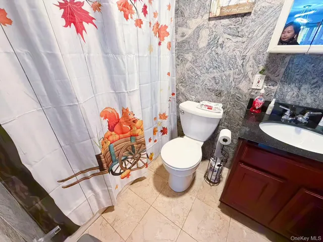 a bathroom with a toilet and sink