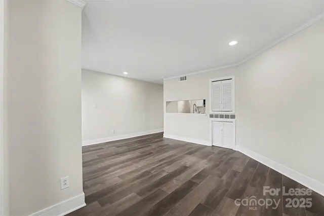 a view of a kitchen with wooden floor