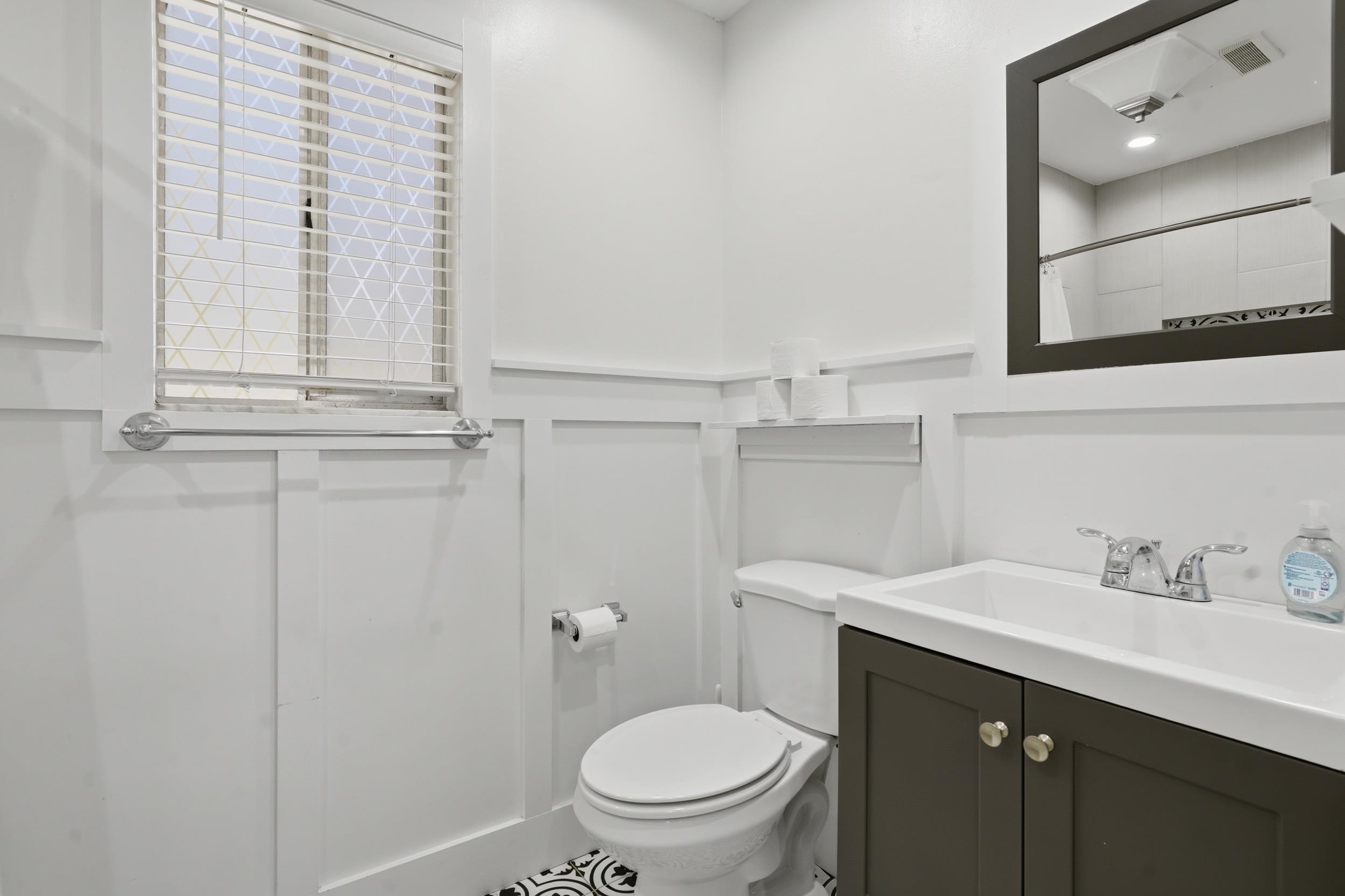 904 Alicante Road St. Augustine, FL 32086 - Photo 21 of 32 Bathroom featuring vanity and a shower with shower curtain