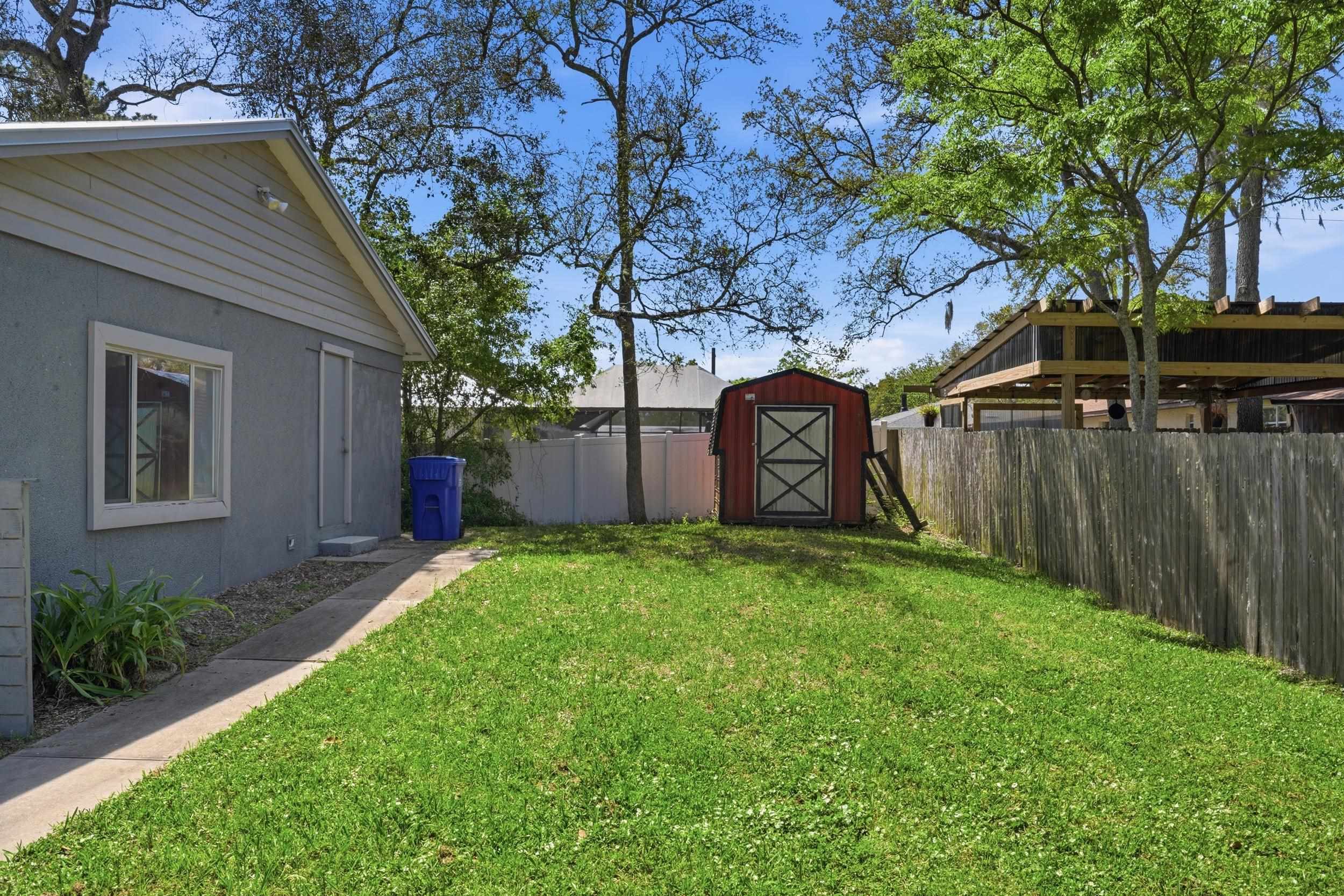 904 Alicante Road St. Augustine, FL 32086 - Photo 28 of 32 Fenced backyard with a shed
