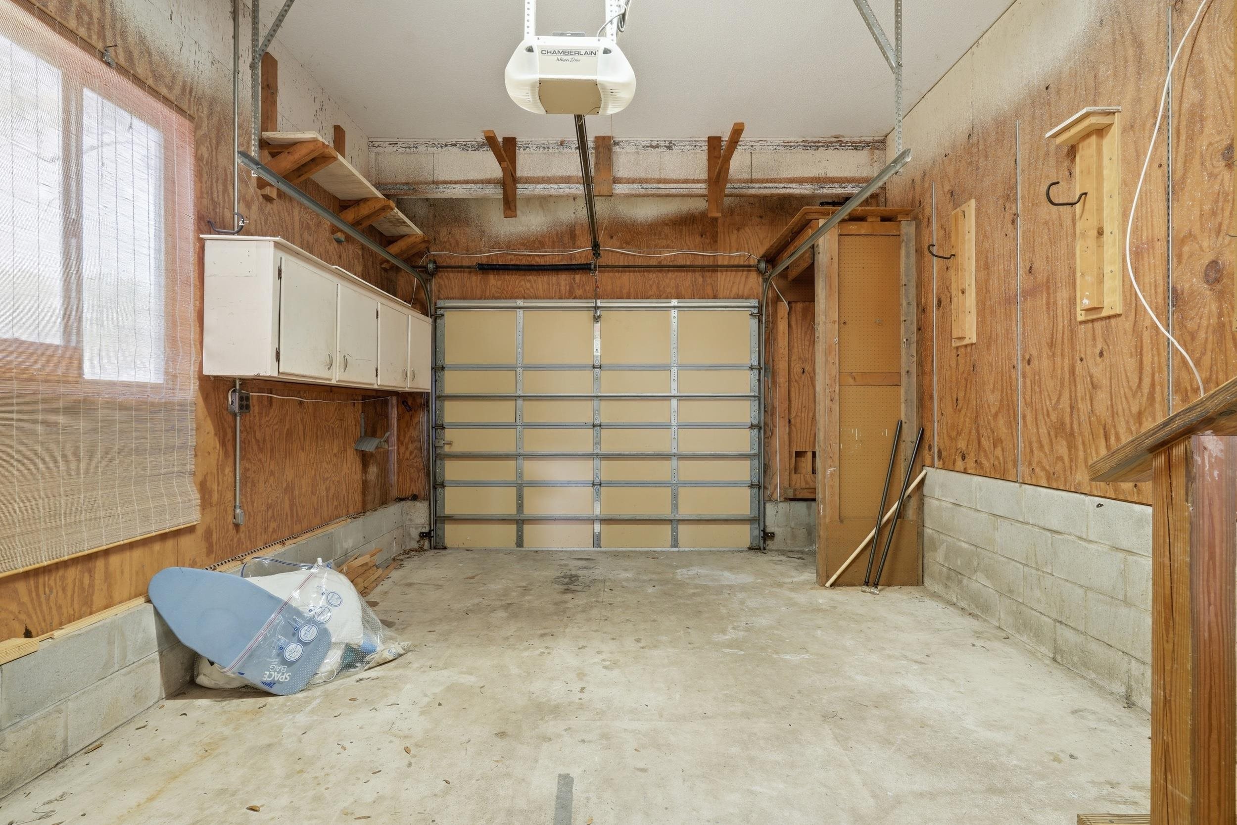 904 Alicante Road St. Augustine, FL 32086 - Photo 29 of 32 Garage featuring a garage door opener