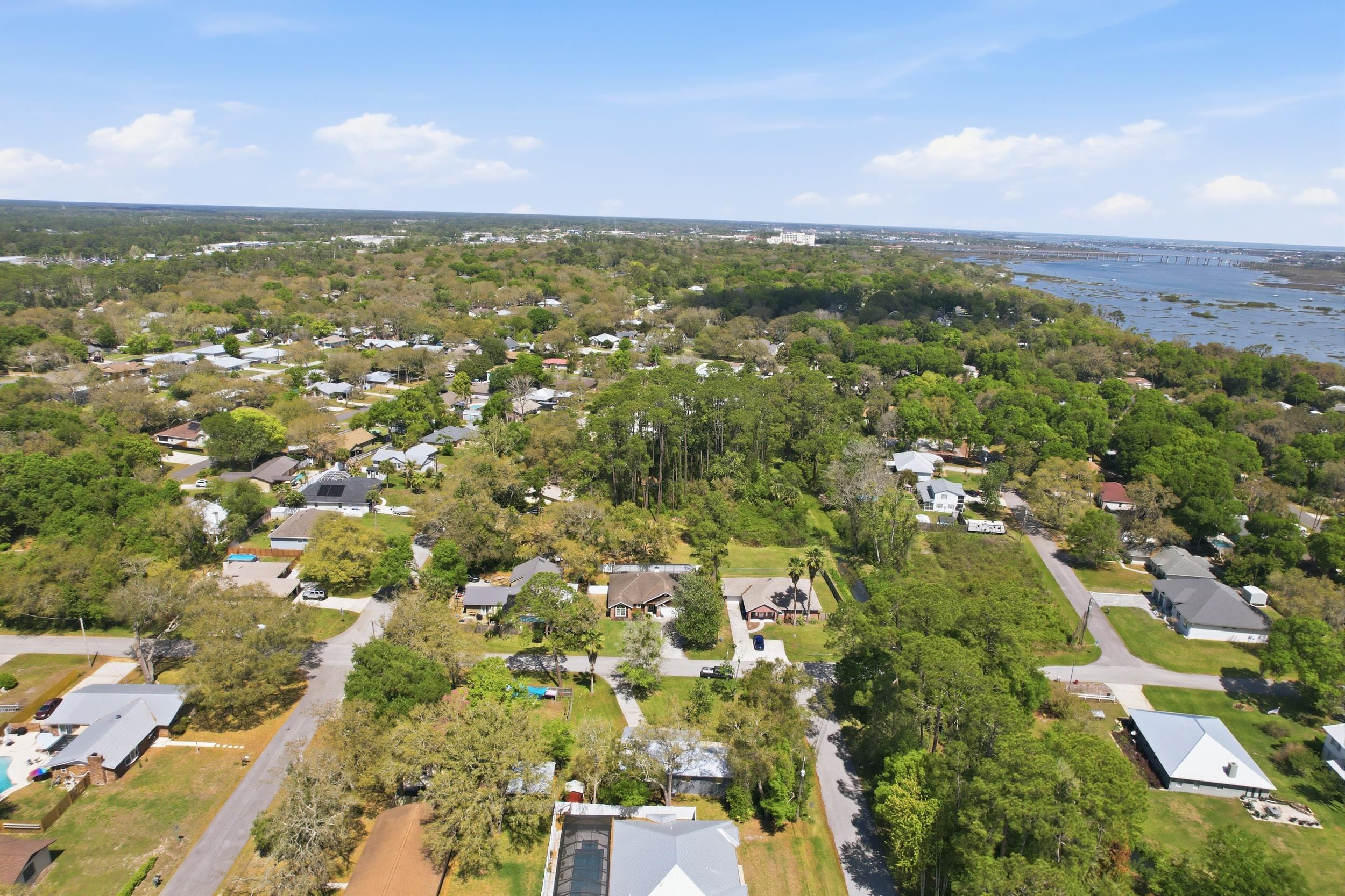 904 Alicante Road St. Augustine, FL 32086 - Photo 31 of 32 Aerial view of residential area featuring a large body of water