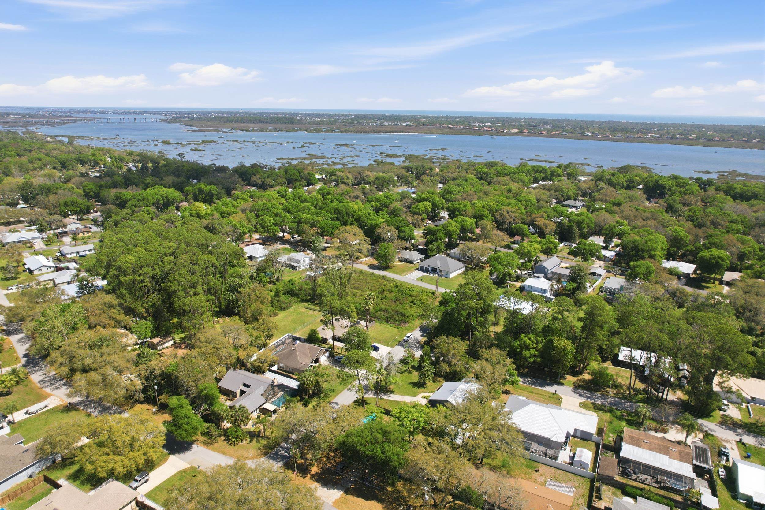 904 Alicante Road St. Augustine, FL 32086 - Photo 4 of 32 Aerial perspective of suburban area featuring a large body of water