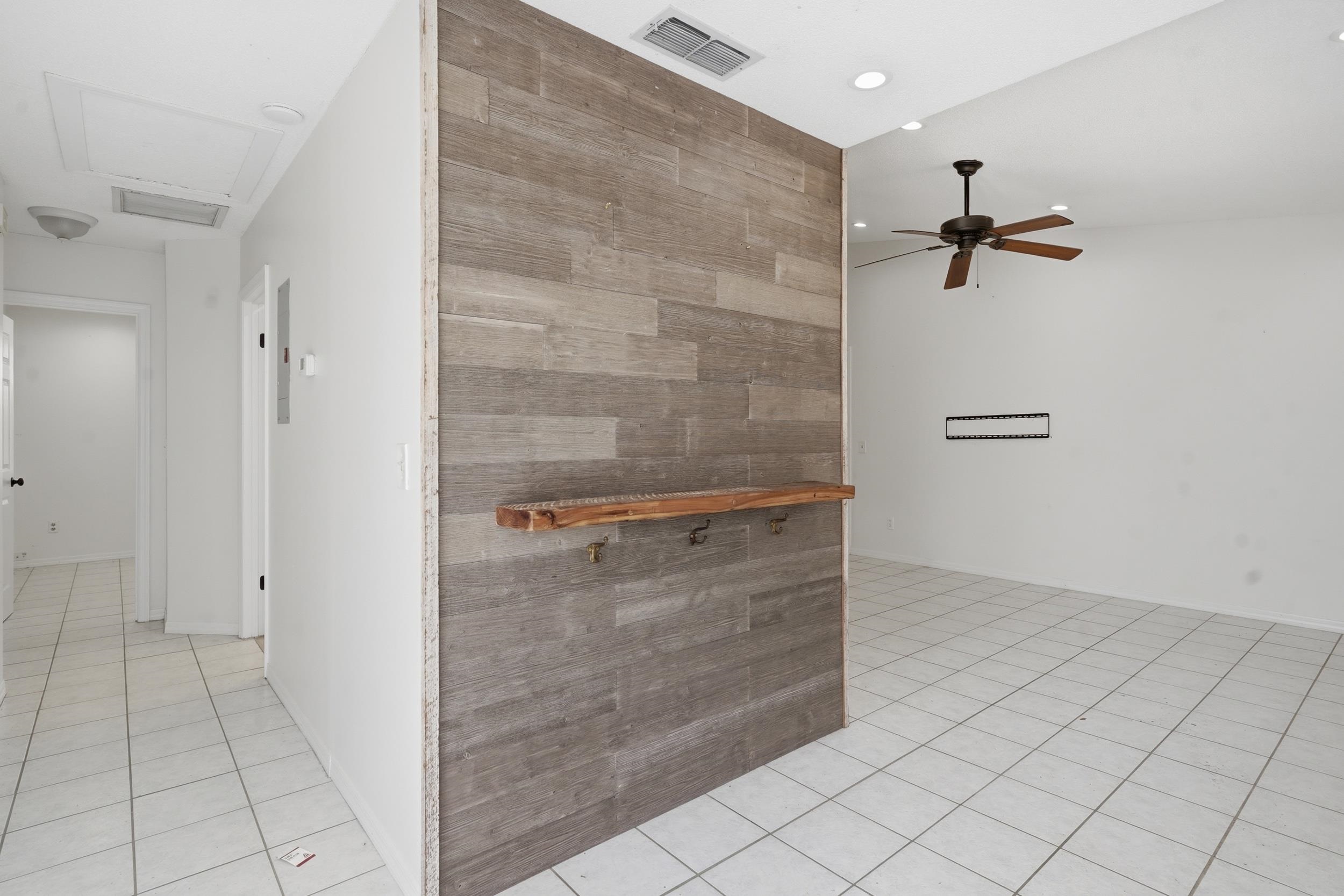 904 Alicante Road St. Augustine, FL 32086 - Photo 7 of 32 Kitchen with wood counters, light tile patterned floors, ceiling fan, and an accent wall