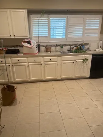 a bathroom with a sink and a window