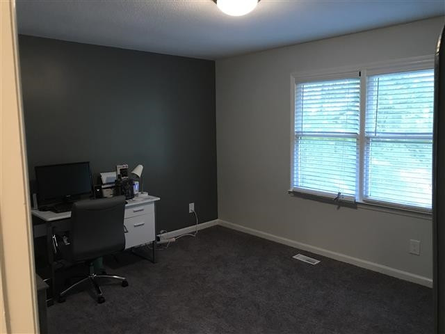 3808 Marcom Street Raleigh, NC 27606 - Photo 8 of 13 a workspace with furniture and a window