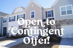 a front view of a house with yard