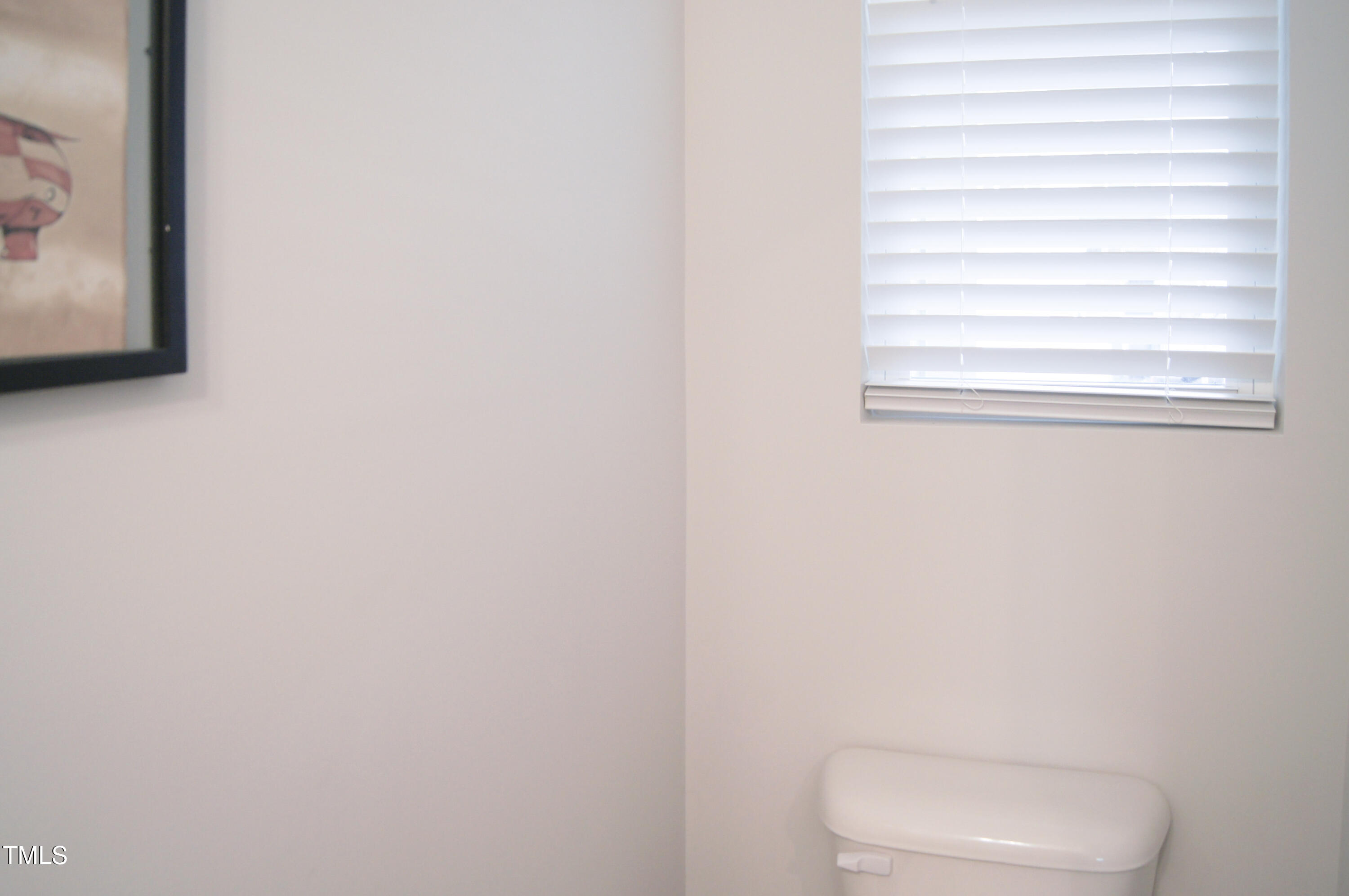 5006 Tura Street Raleigh, NC 27610 - Photo 11 of 67 a white toilet sitting next to a shower