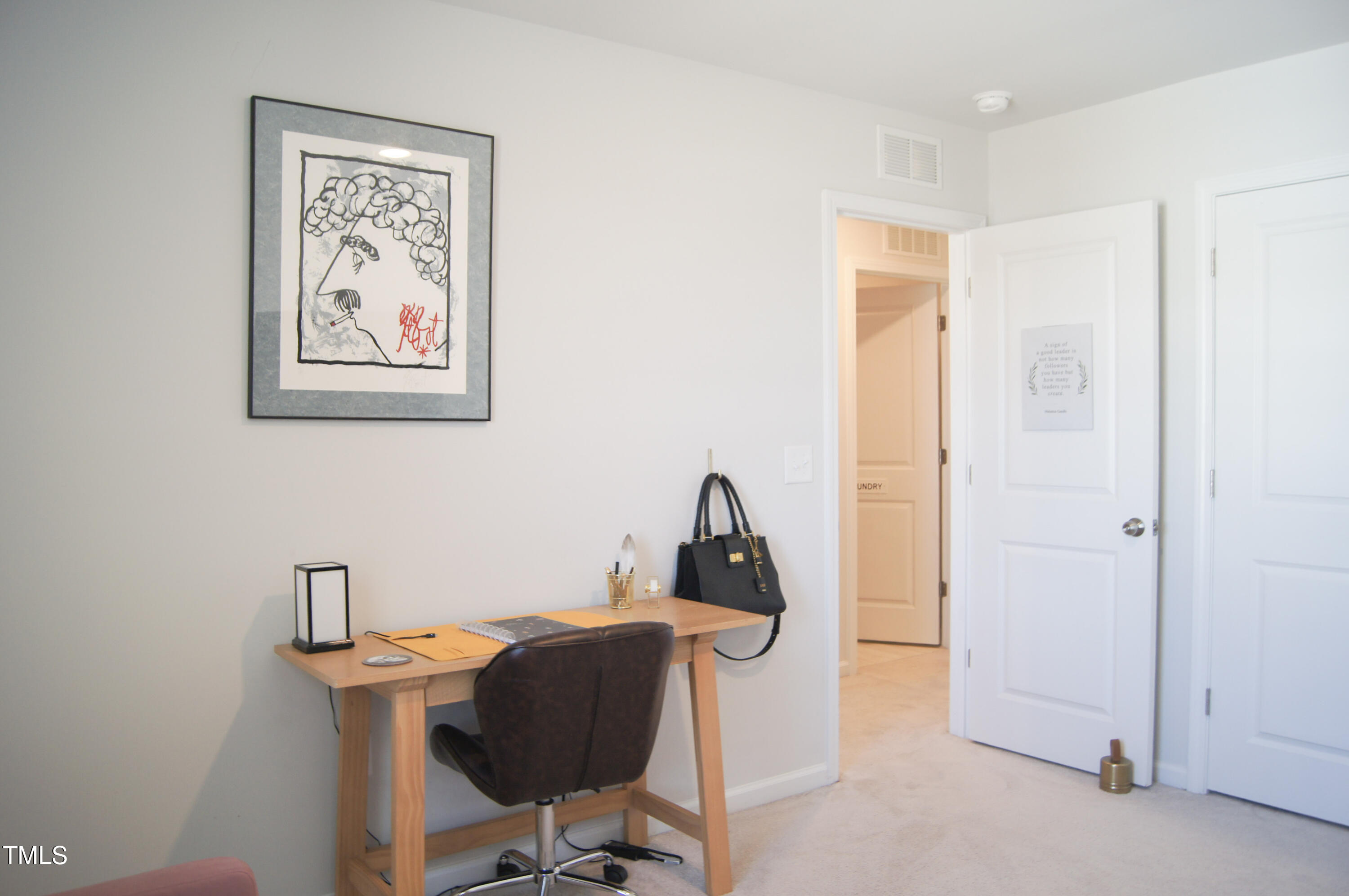 5006 Tura Street Raleigh, NC 27610 - Photo 30 of 67 a view of a workspace with furniture and a window