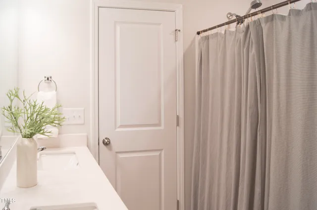 a front view of a house with swimming pool and a yard