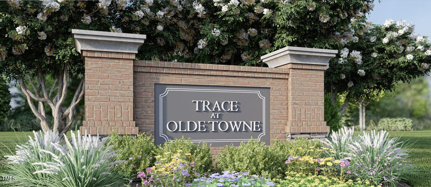 5006 Tura Street Raleigh, NC 27610 - Photo 44 of 67 a sign that is on a brick wall