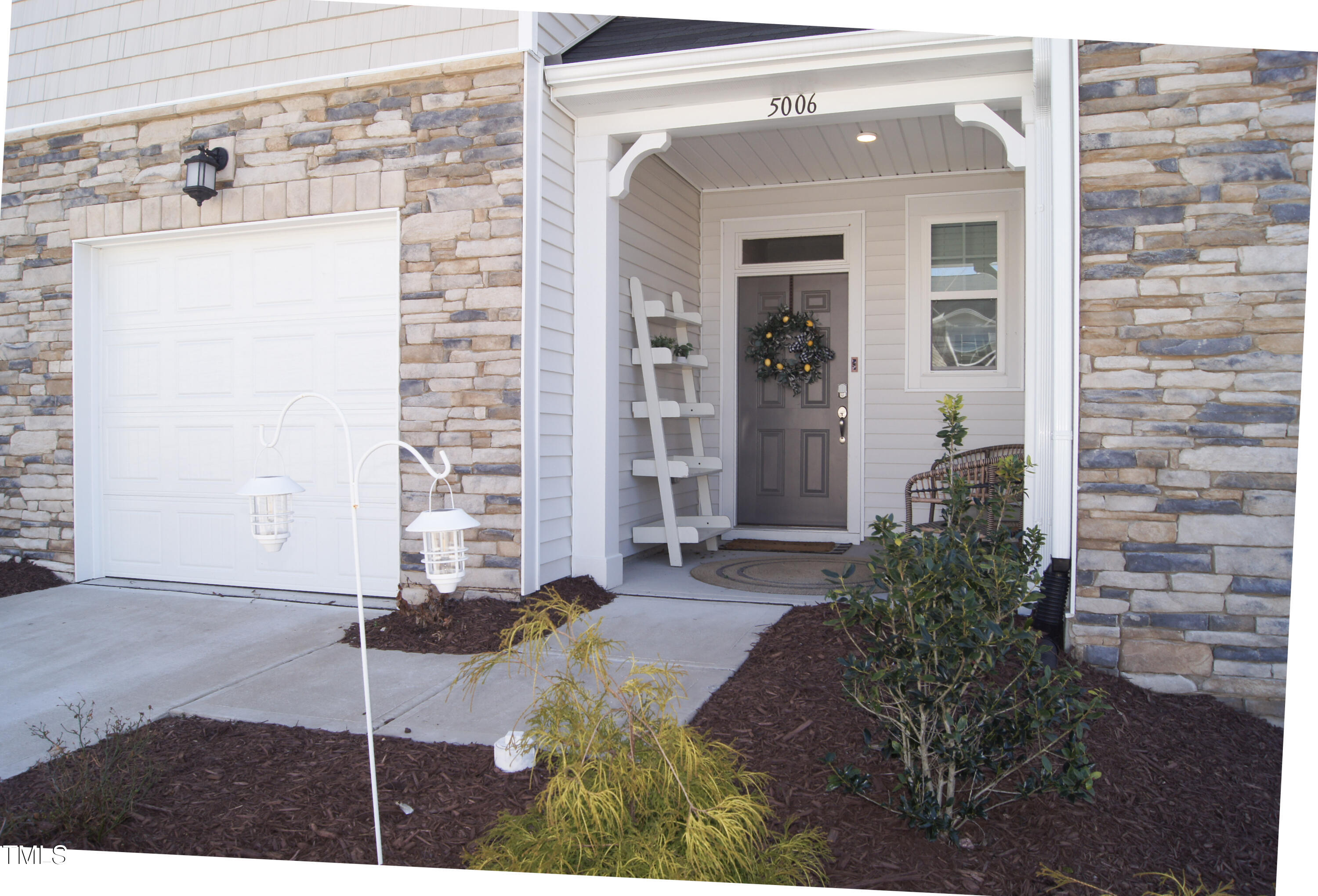 5006 Tura Street Raleigh, NC 27610 - Photo 5 of 67 a front view of a house with a yard