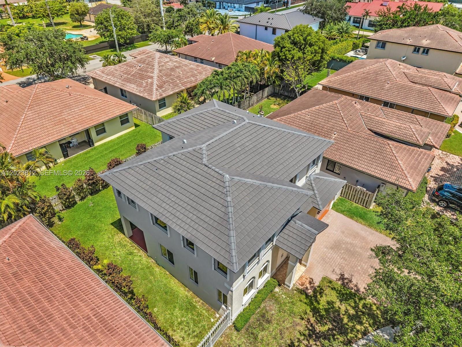 2864 Southwest 138th Path Miami, FL 33175 - Photo 3 of 40 an aerial view of a house with a yard