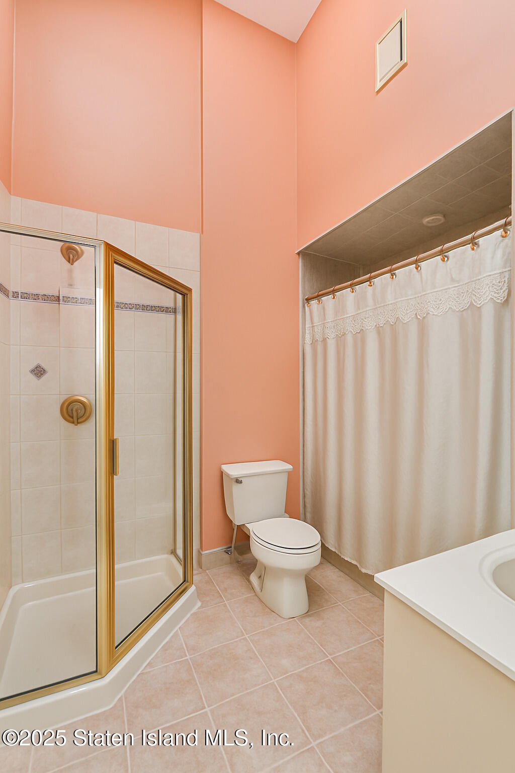 41 Wolcott Avenue Staten Island, NY 10312 - Photo 11 of 33 a bathroom with a sink a toilet and shower