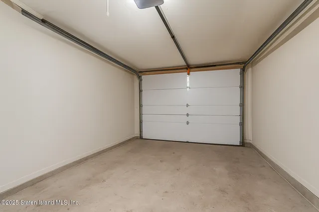 a kitchen with a refrigerator and a stove top oven