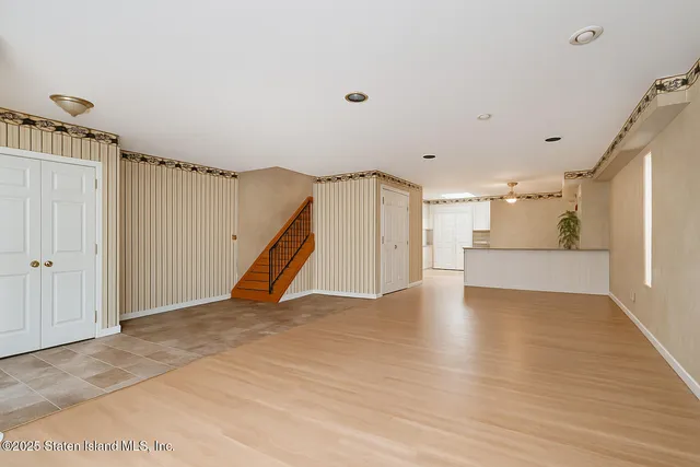 a view of a balcony with wooden floor