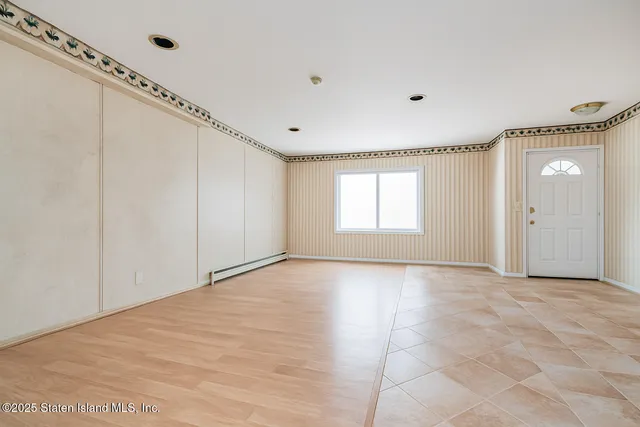 a view of an empty room with a window