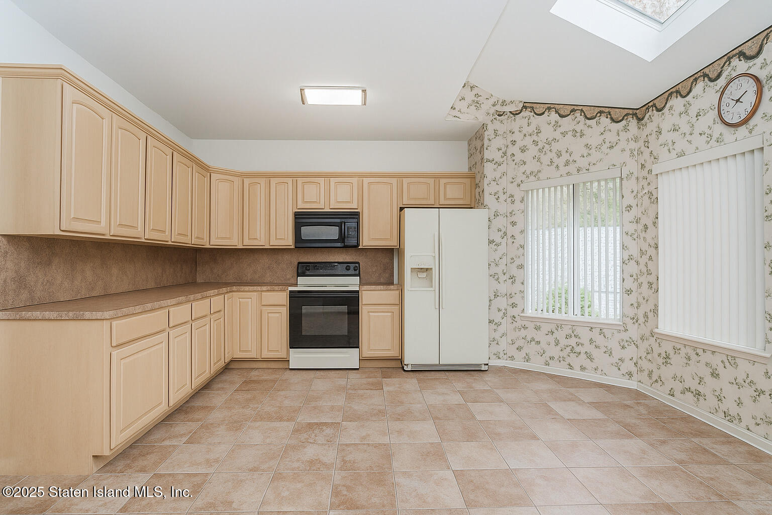 41 Wolcott Avenue Staten Island, NY 10312 - Photo 25 of 33 a kitchen with a refrigerator and a stove top oven