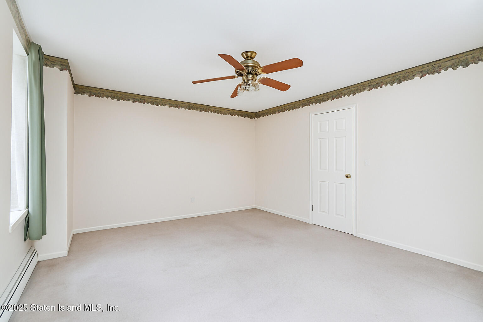 41 Wolcott Avenue Staten Island, NY 10312 - Photo 27 of 33 a view of a ceiling fan in a room
