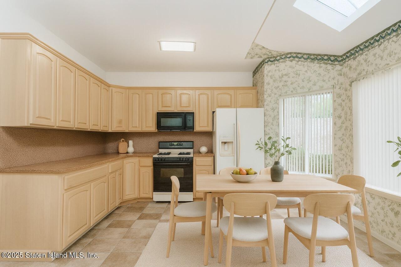 41 Wolcott Avenue Staten Island, NY 10312 - Photo 5 of 33 a kitchen with stainless steel appliances kitchen island granite countertop a sink and cabinets