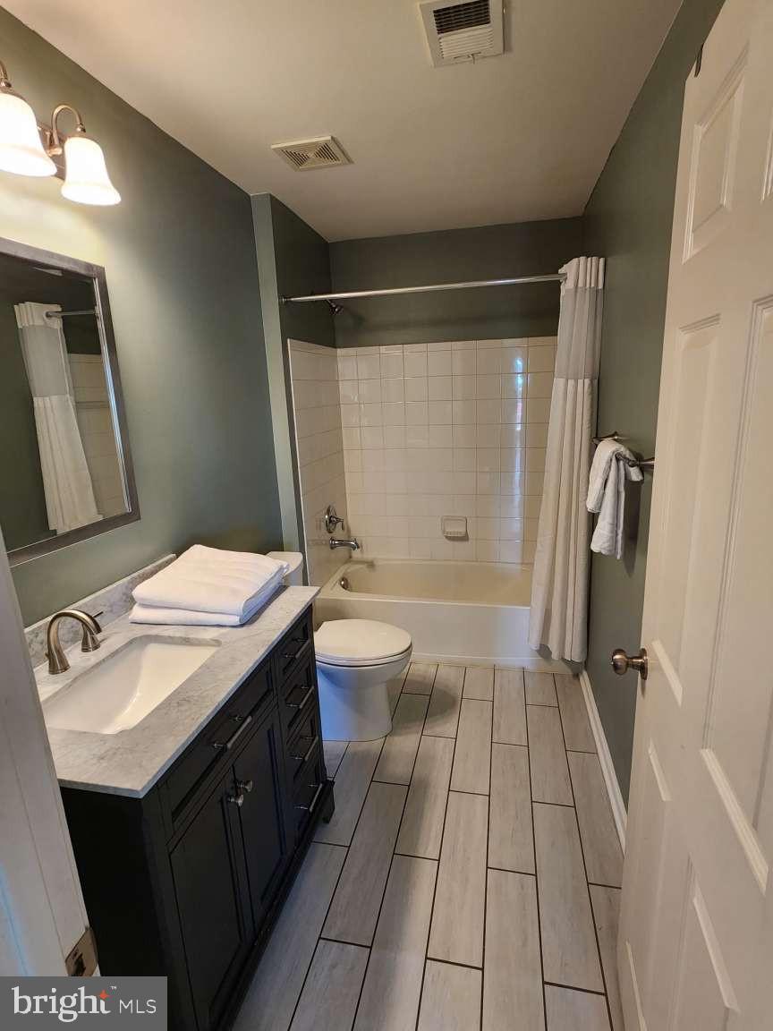 2040 Waterfall Drive Hanover, PA 17331 - Photo 12 of 25 a bathroom with a sink a toilet a mirror and shower