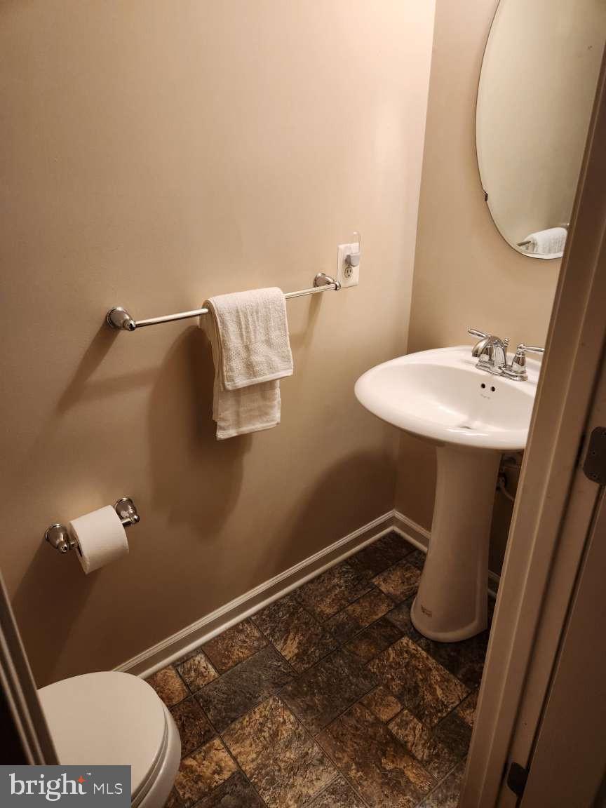 2040 Waterfall Drive Hanover, PA 17331 - Photo 14 of 25 a bathroom with a sink mirror vanity and toilet
