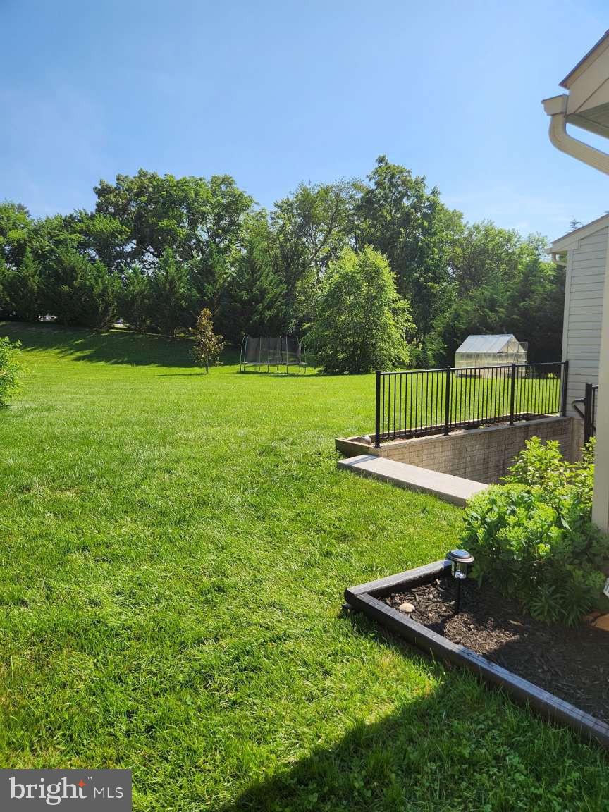 2040 Waterfall Drive Hanover, PA 17331 - Photo 17 of 25 a view of a garden with a bench in the background
