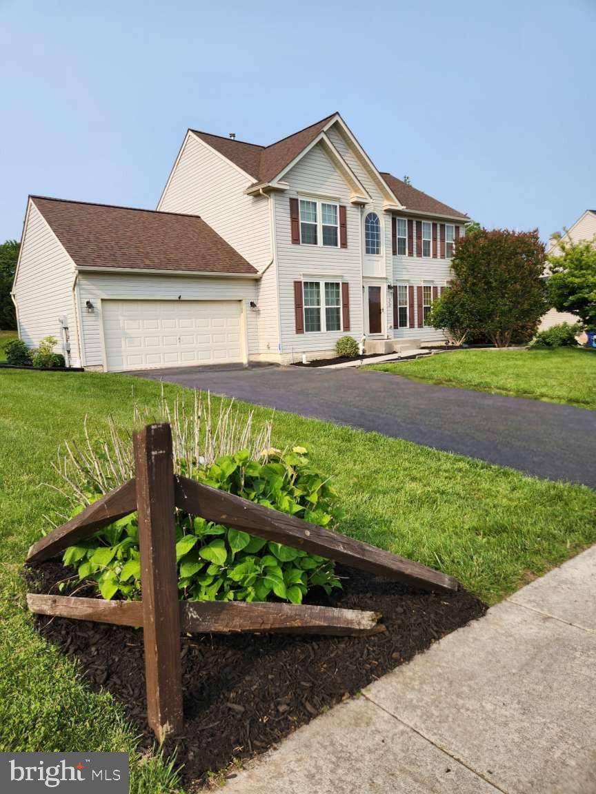 2040 Waterfall Drive Hanover, PA 17331 - Photo 22 of 25 a front view of a house with a yard and potted plants