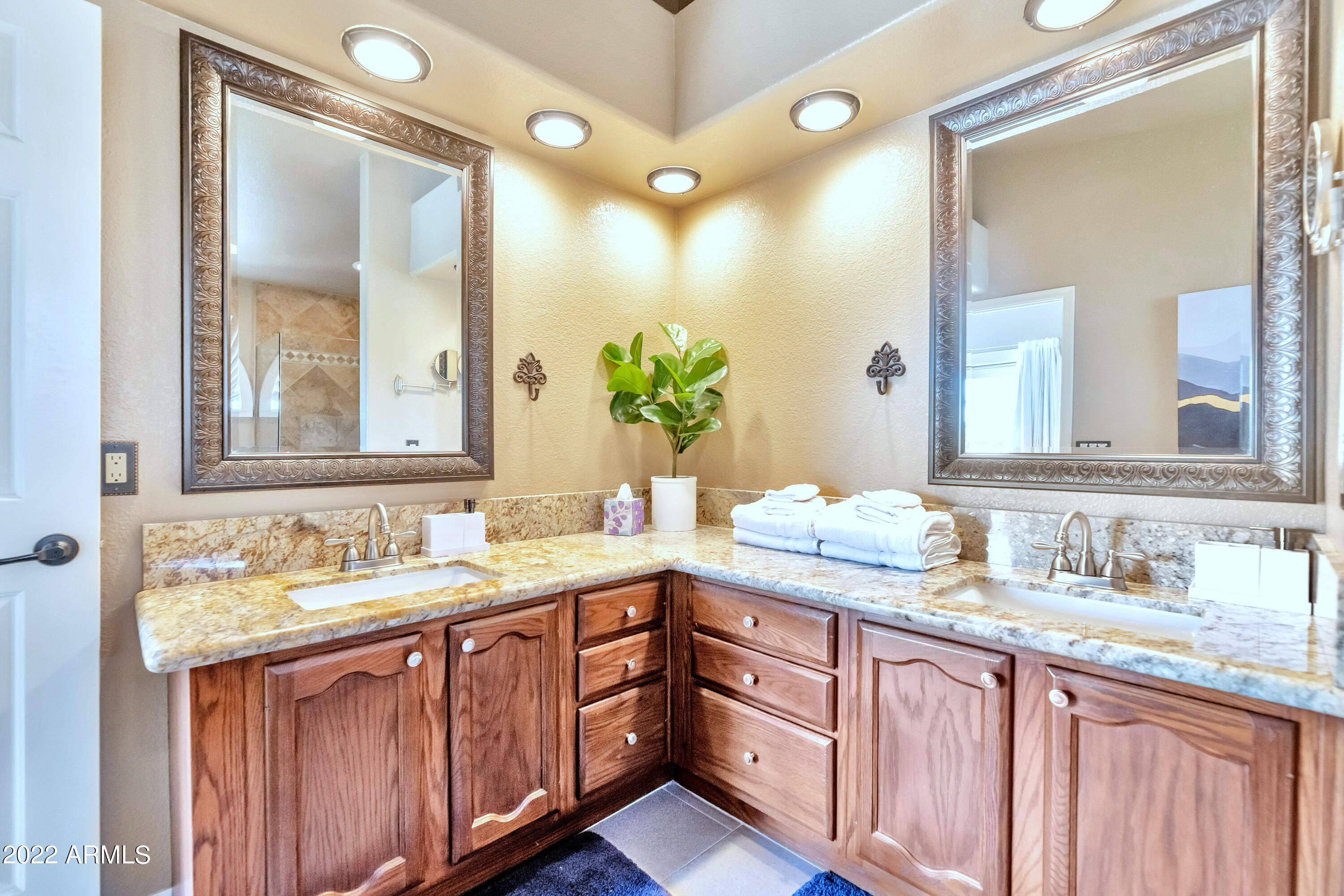 14227 North 57th Way Scottsdale, AZ 85254 - Photo 13 of 25 a bathroom with a granite countertop sink and a mirror