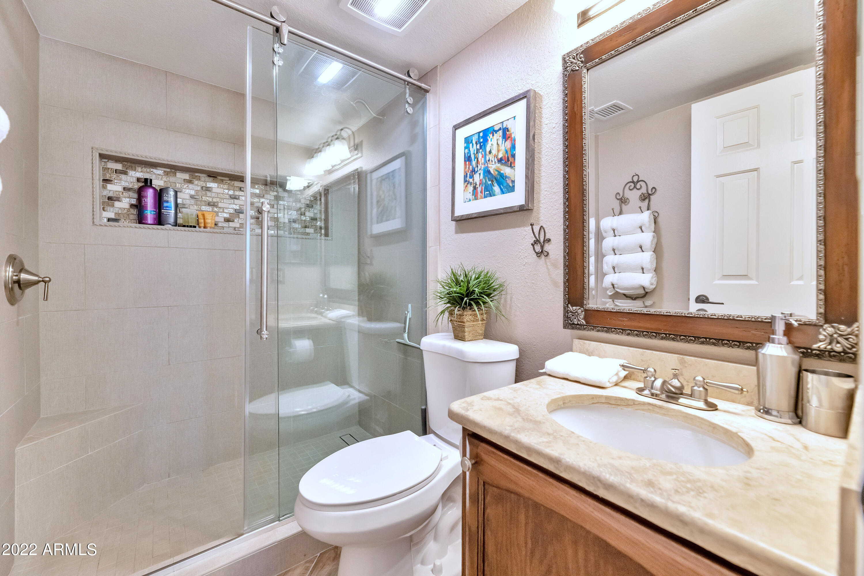 14227 North 57th Way Scottsdale, AZ 85254 - Photo 17 of 25 a bathroom with a granite countertop sink toilet and shower