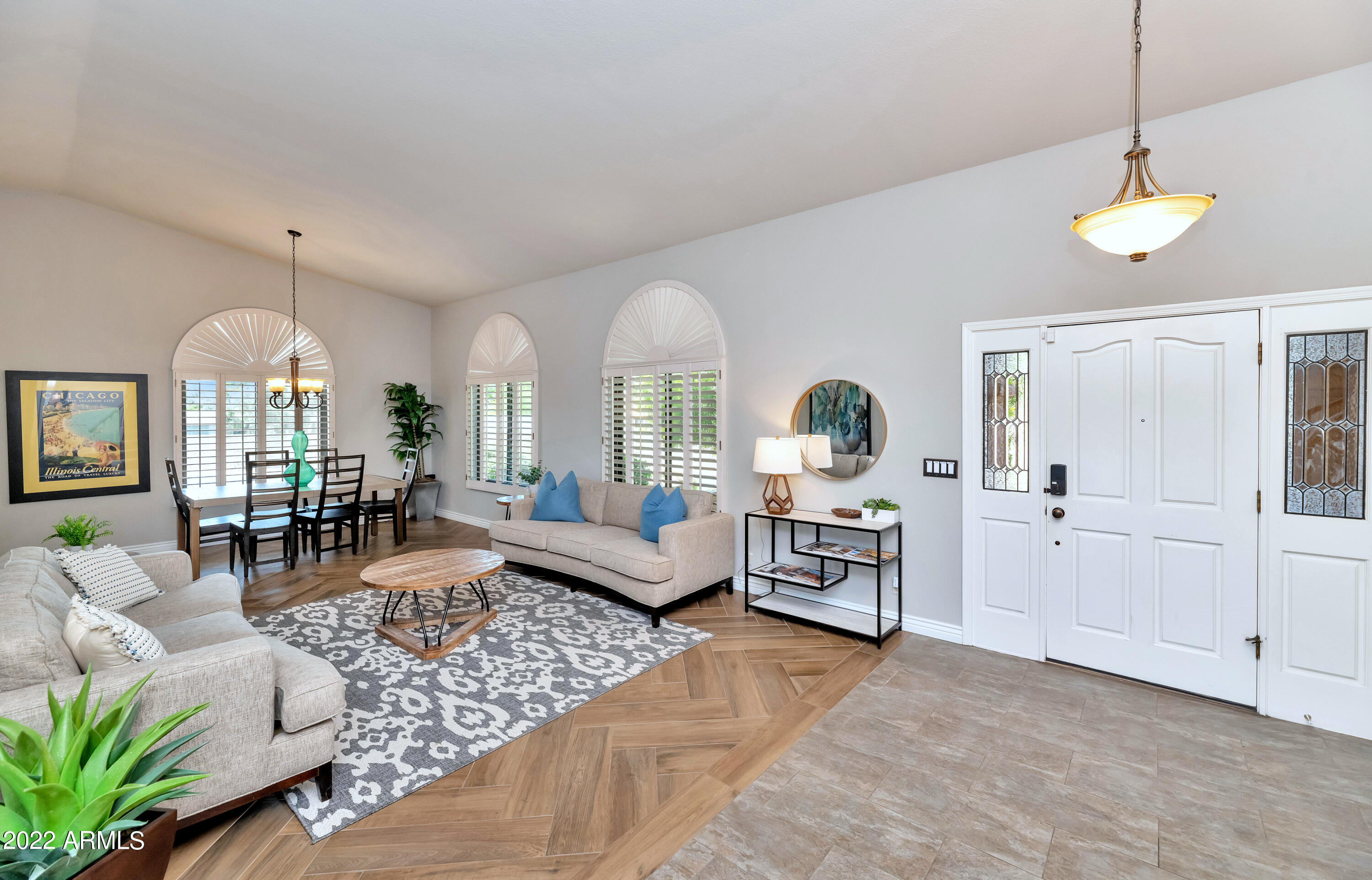 14227 North 57th Way Scottsdale, AZ 85254 - Photo 2 of 25 a living room with furniture chandelier and a fireplace