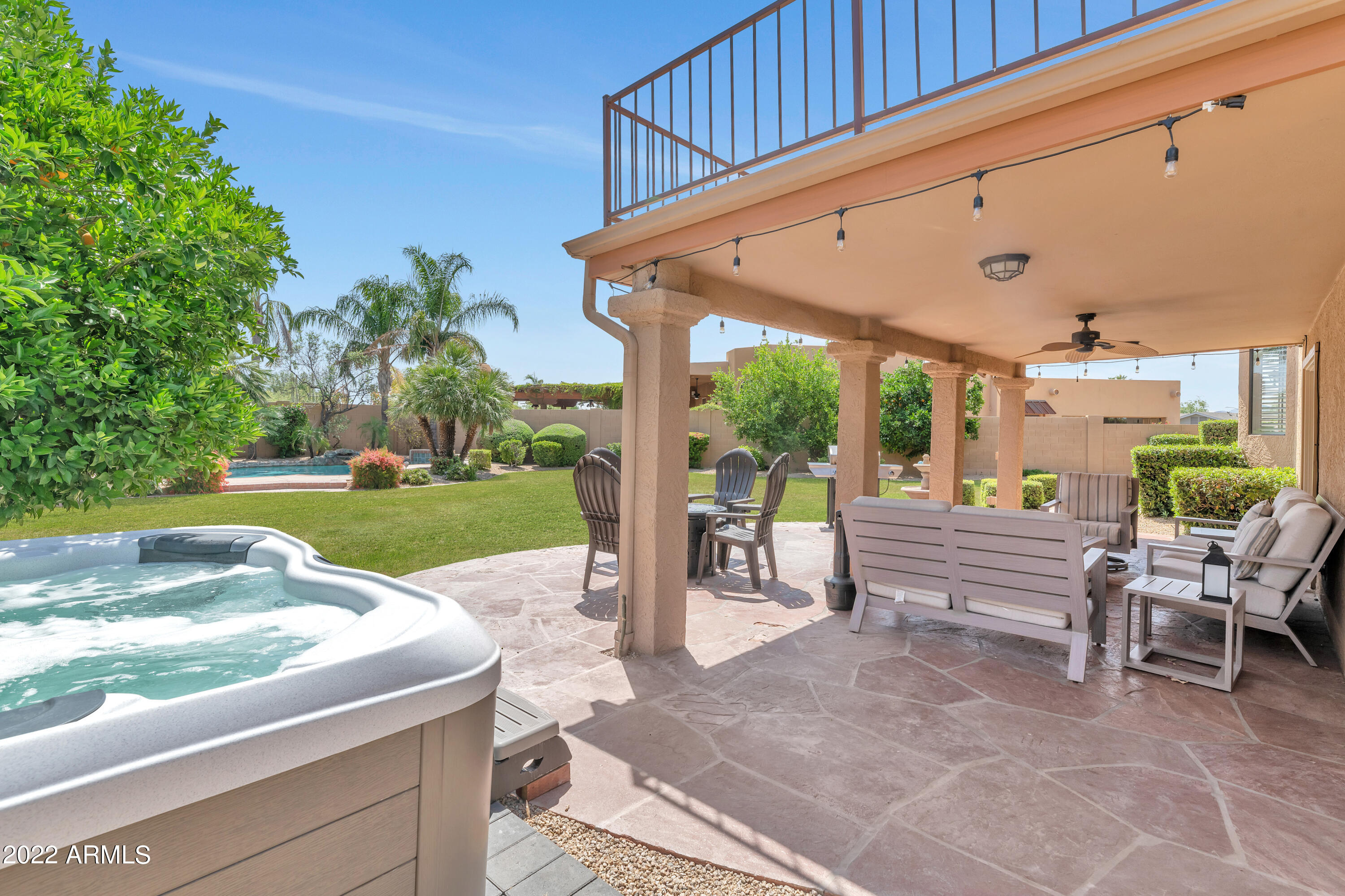 14227 North 57th Way Scottsdale, AZ 85254 - Photo 21 of 25 a view of a patio with a table chairs and a backyard