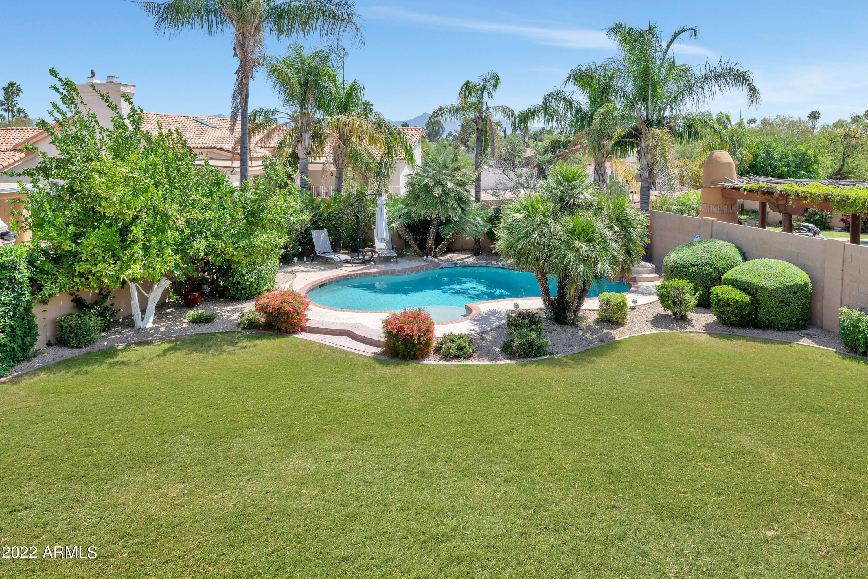 14227 North 57th Way Scottsdale, AZ 85254 - Photo 22 of 25 a backyard of a house with lots of green space