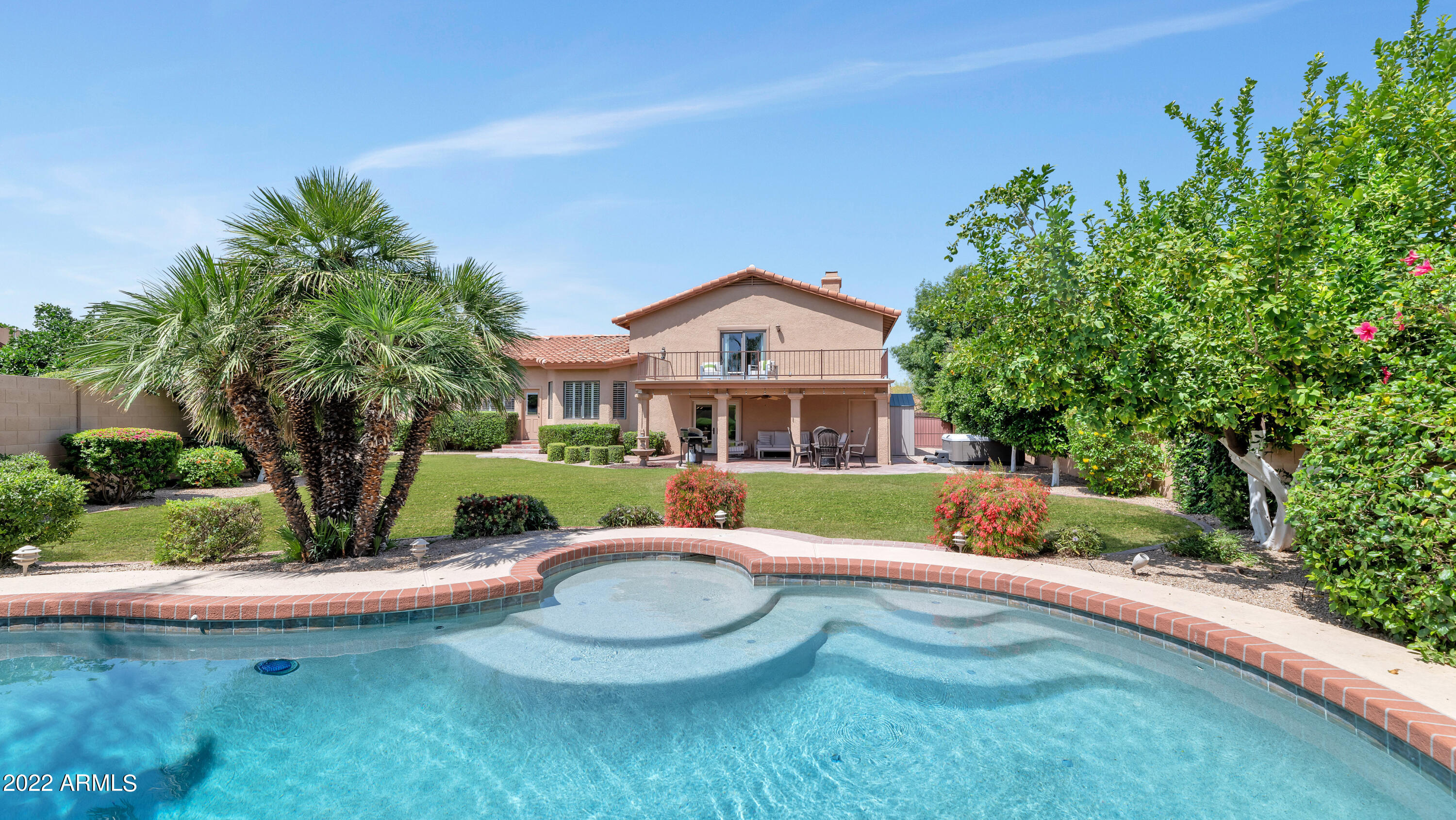 14227 North 57th Way Scottsdale, AZ 85254 - Photo 24 of 25 a front view of a house with a yard table and chairs