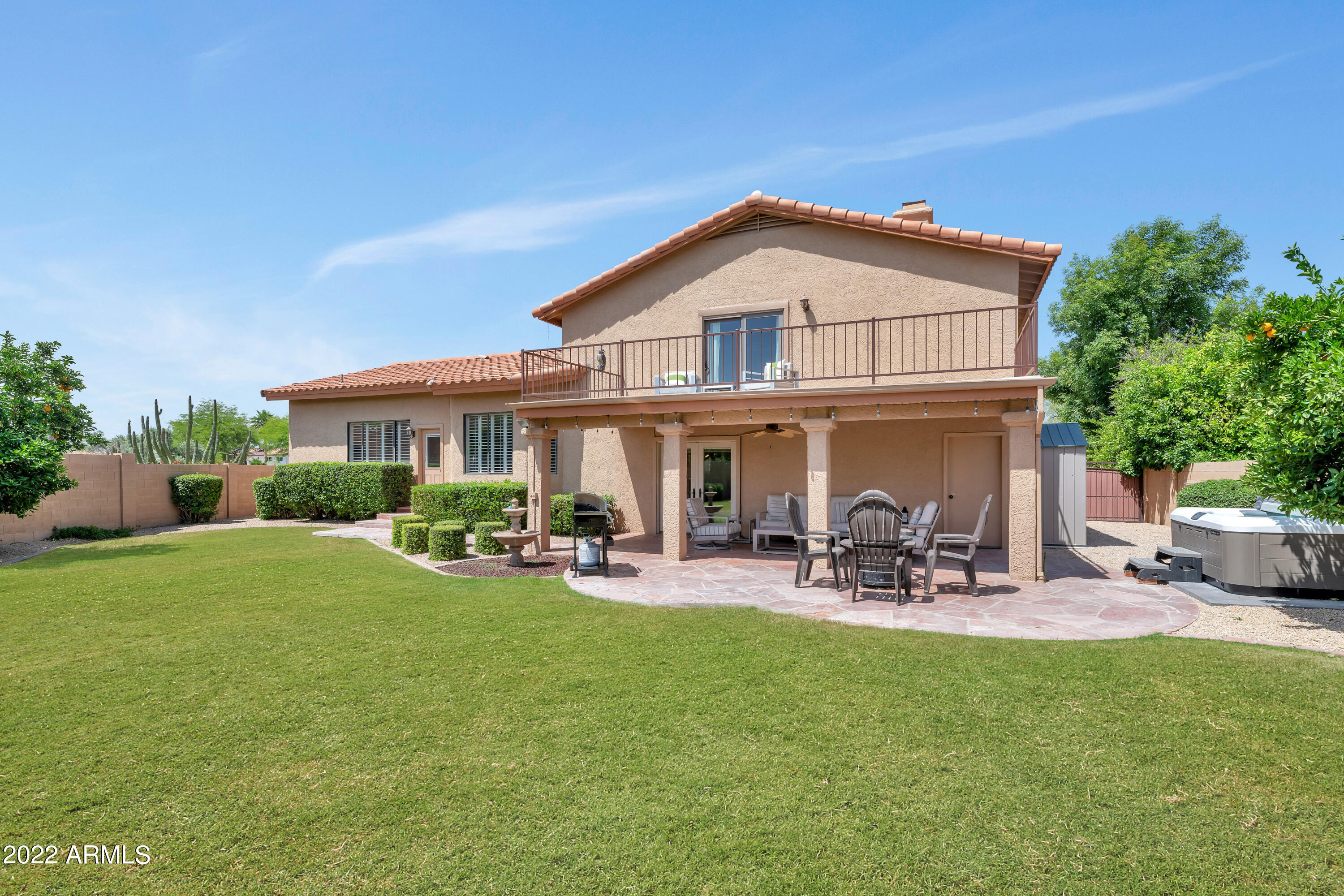 14227 North 57th Way Scottsdale, AZ 85254 - Photo 25 of 25 a view of a house with backyard sitting area and garden