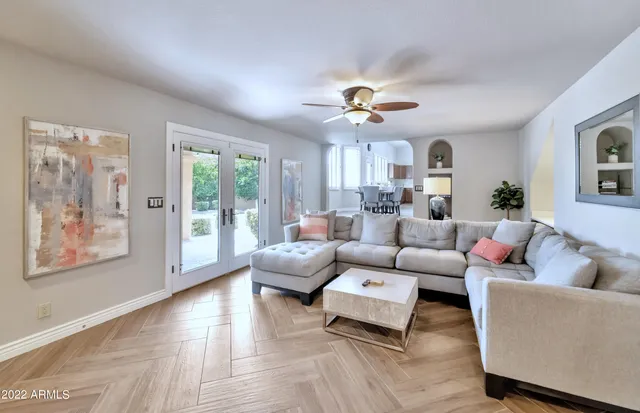 a living room with furniture and a large window