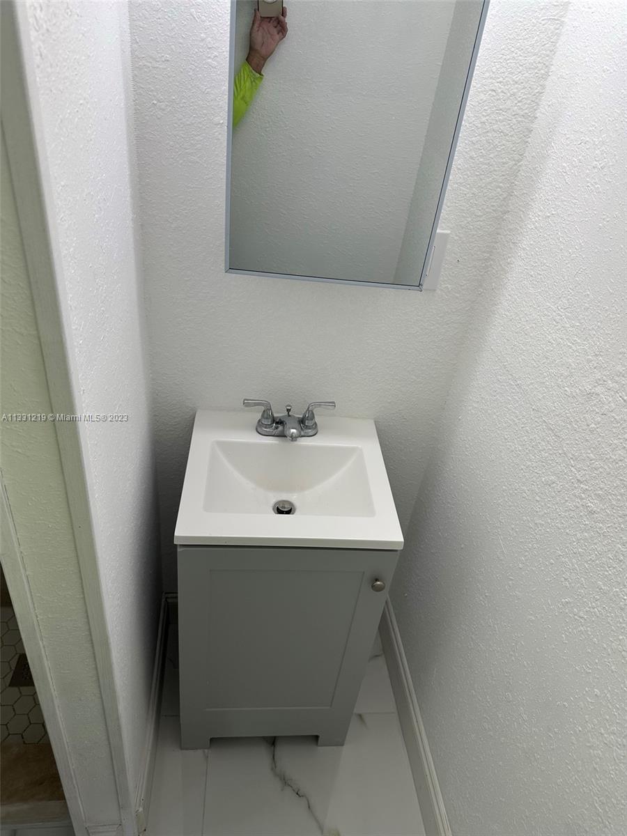 2625 Northwest 55th Street, Unit 3 Miami, FL 33142 - Photo 3 of 3 a utility room with sink dryer and washer