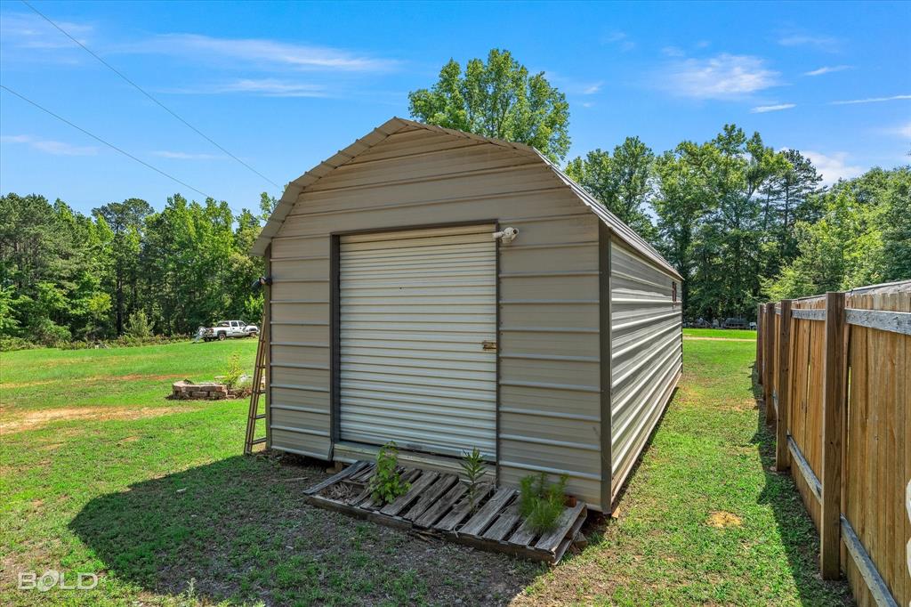 2153 Highway 2 Plain Dealing, LA 71064 - Photo 12 of 39 a house view with a backyard space