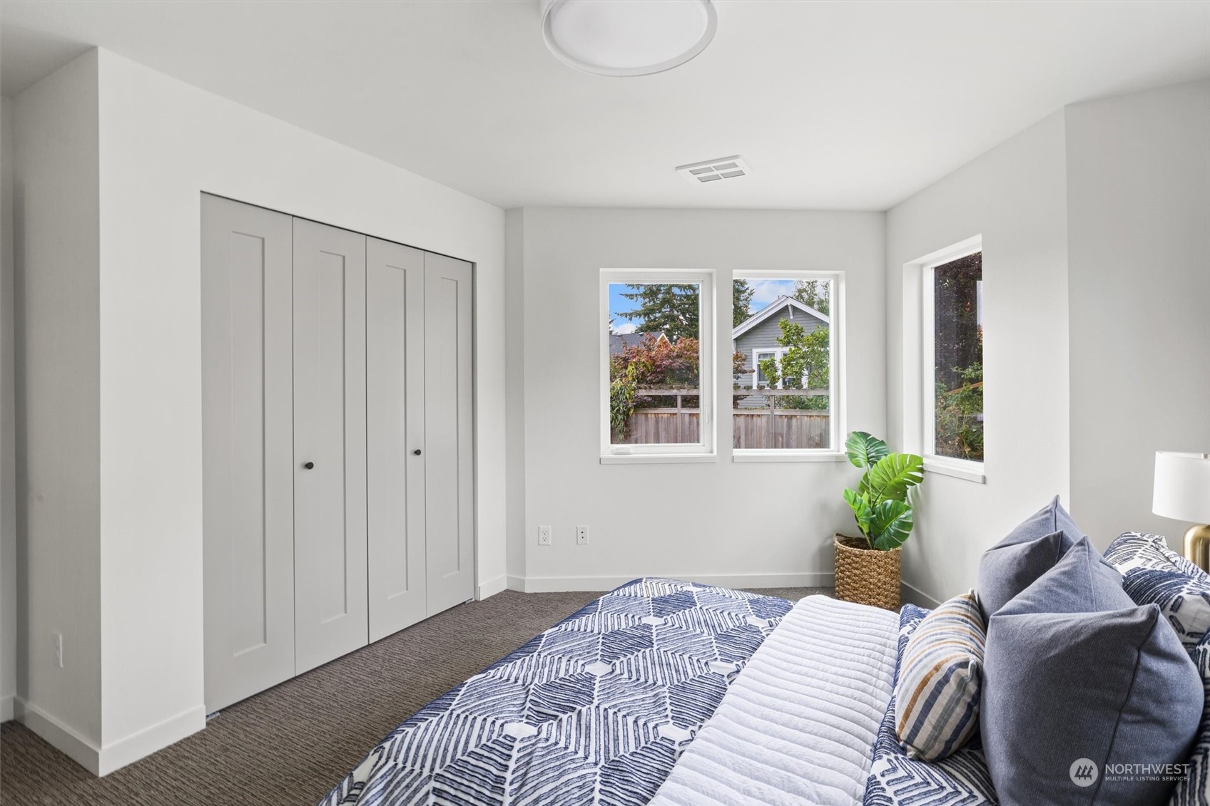 8021 17th Avenue Northwest Seattle, WA 98117 - Photo 14 of 23 a bedroom with a bed and window