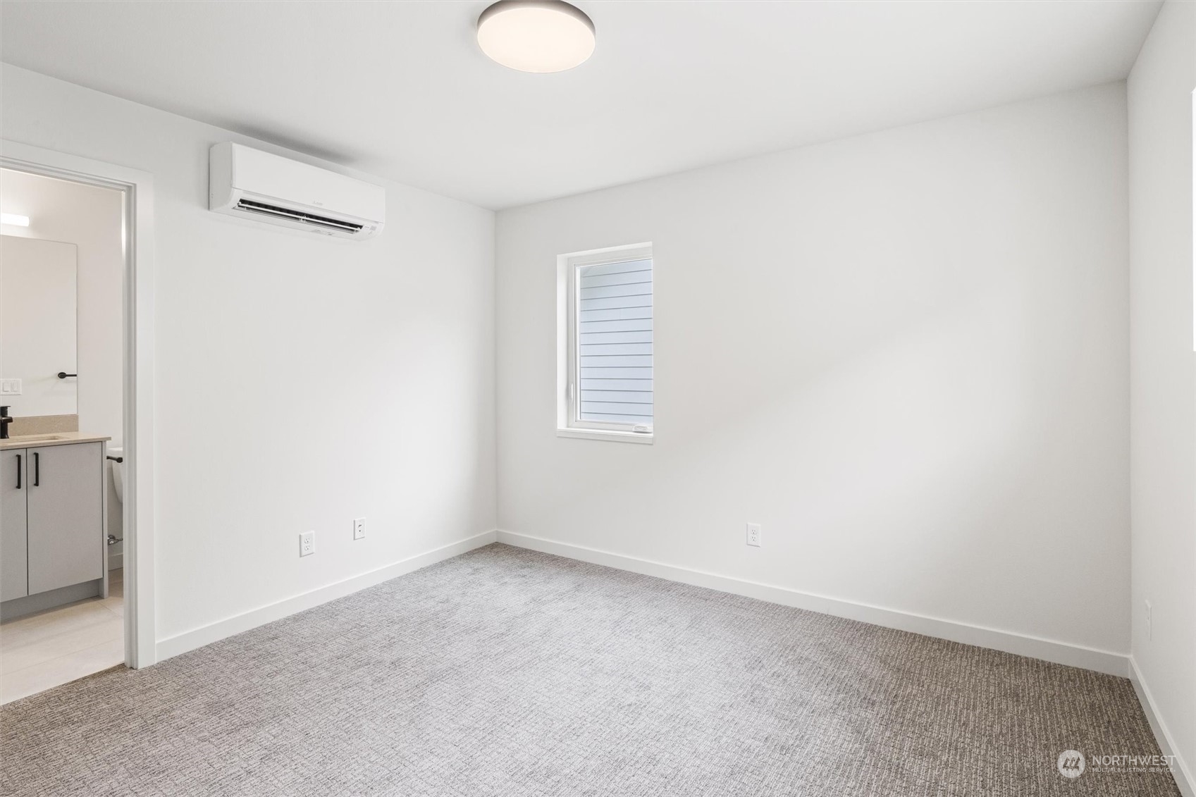 8021 17th Avenue Northwest Seattle, WA 98117 - Photo 16 of 23 an empty room with windows