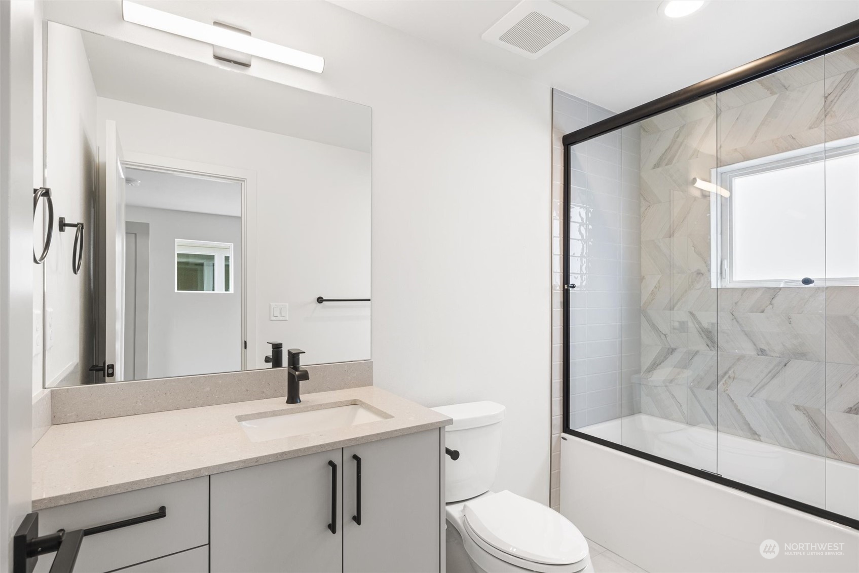 8021 17th Avenue Northwest Seattle, WA 98117 - Photo 19 of 23 a bathroom with a sink toilet and shower