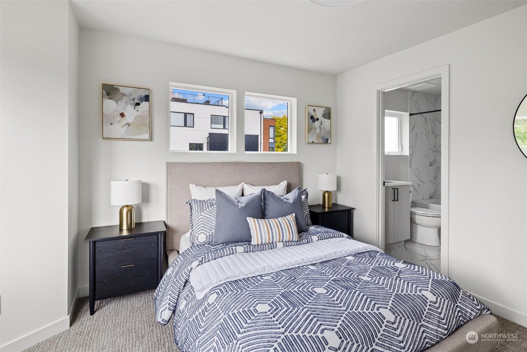 8021 17th Avenue Northwest Seattle, WA 98117 - Photo 20 of 23 a bedroom with a bed and painting on the wall