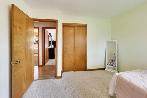 a bed room with a bed and a window
