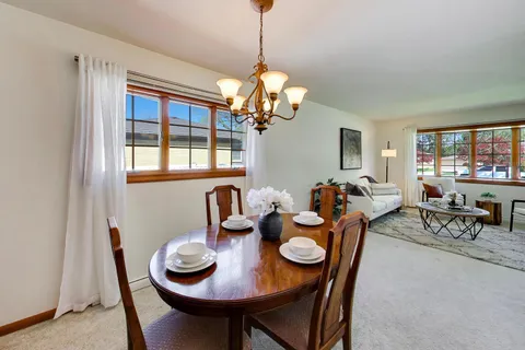 a view of a dining room with furniture window and outside view
